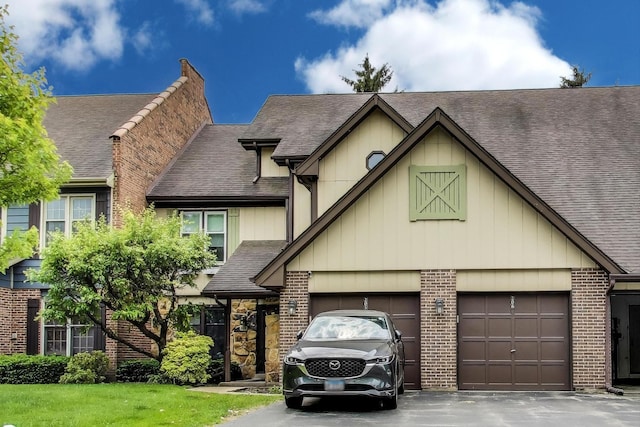 206 Country Ln, Des Plaines, IL 60016 - view of front of property with roof with shingles, asphalt driveway, and brick siding