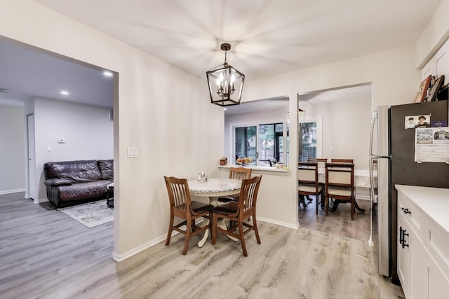 206 Country Ln, Des Plaines, IL 60016 - dining room featuring light wood-style floors, a chandelier, and recessed lighting