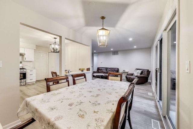 206 Country Ln, Des Plaines, IL 60016 - dining room featuring a chandelier, light wood-style flooring, and recessed lighting