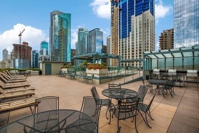 474 N Lake Shore Dr Unit 2801, Chicago, IL 60611 - view of patio featuring a view of skyline and outdoor dining space
