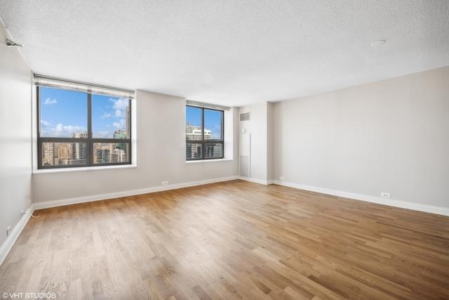 474 N Lake Shore Dr Unit 2801, Chicago, IL 60611 - empty room with wood finished floors and a textured ceiling