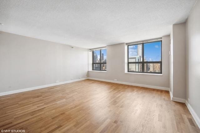 474 N Lake Shore Dr Unit 2801, Chicago, IL 60611 - empty room featuring light wood-style floors and a textured ceiling
