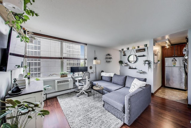 3033 N Sheridan Rd Unit 602, Chicago, IL 60657 - living room featuring wood finished floors, an office area, an AC wall unit, and baseboard heating