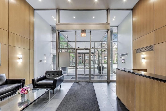 3033 N Sheridan Rd Unit 602, Chicago, IL 60657 - common area with floor to ceiling windows, a towering ceiling, and recessed lighting