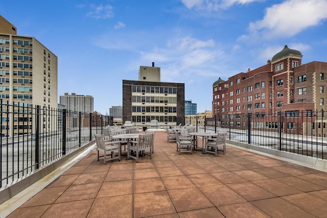 3033 N Sheridan Rd Unit 602, Chicago, IL 60657 - view of patio featuring outdoor dining area and a city view
