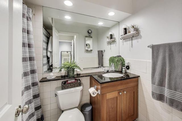 3033 N Sheridan Rd Unit 602, Chicago, IL 60657 - bathroom with tile walls, vanity, recessed lighting, and a wainscoted wall