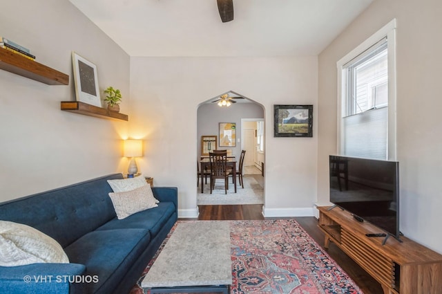 2835 S Farrell St, Chicago, IL 60608 - living area with ceiling fan, arched walkways, and dark wood finished floors