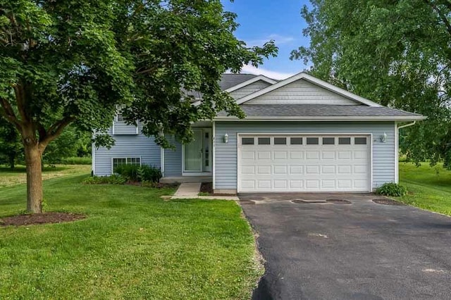 411 Benedict Dr SW, Poplar Grove, IL 61065 - view of front of house featuring driveway, a front lawn, an attached garage, and roof with shingles