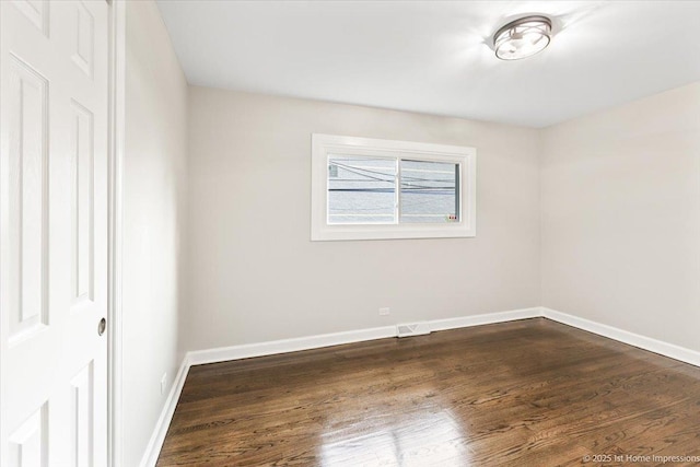 16211 Joyce Cir, South Holland, IL 60473 - spare room featuring dark wood finished floors and baseboards
