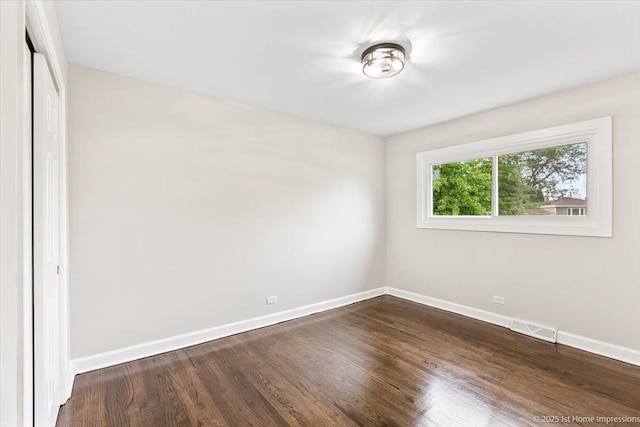 16211 Joyce Cir, South Holland, IL 60473 - unfurnished bedroom with dark wood-style floors and a closet