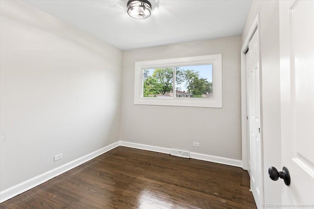 16211 Joyce Cir, South Holland, IL 60473 - unfurnished bedroom featuring dark wood-style floors and a closet