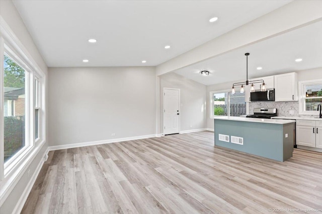 16211 Joyce Cir, South Holland, IL 60473 - kitchen with stainless steel appliances, light wood-style floors, tasteful backsplash, white cabinetry, and recessed lighting