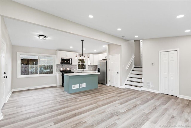 16211 Joyce Cir, South Holland, IL 60473 - kitchen with stainless steel appliances, white cabinets, backsplash, a kitchen island, and recessed lighting