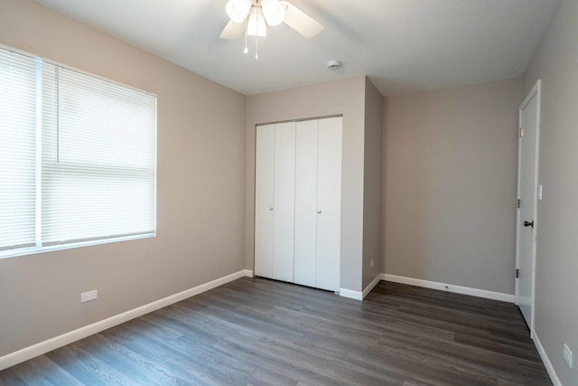 1745 N 40th Ave, Stone Park, IL 60165 - unfurnished bedroom with dark wood-style floors, a closet, and ceiling fan