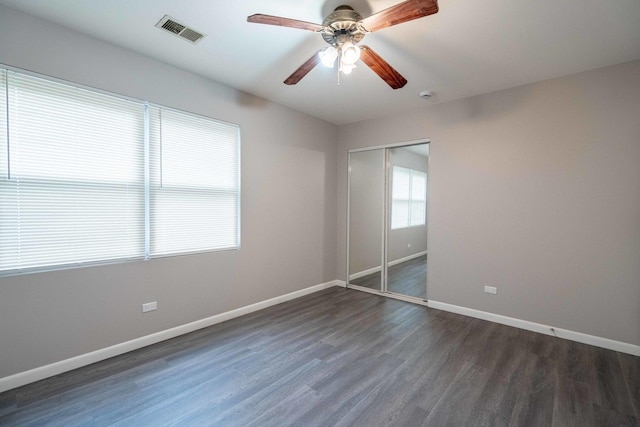 1745 N 40th Ave, Stone Park, IL 60165 - unfurnished bedroom with dark wood finished floors, a closet, and ceiling fan