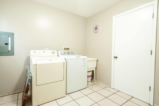1745 N 40th Ave, Stone Park, IL 60165 - laundry room with electric panel, washing machine and clothes dryer, and light tile patterned floors