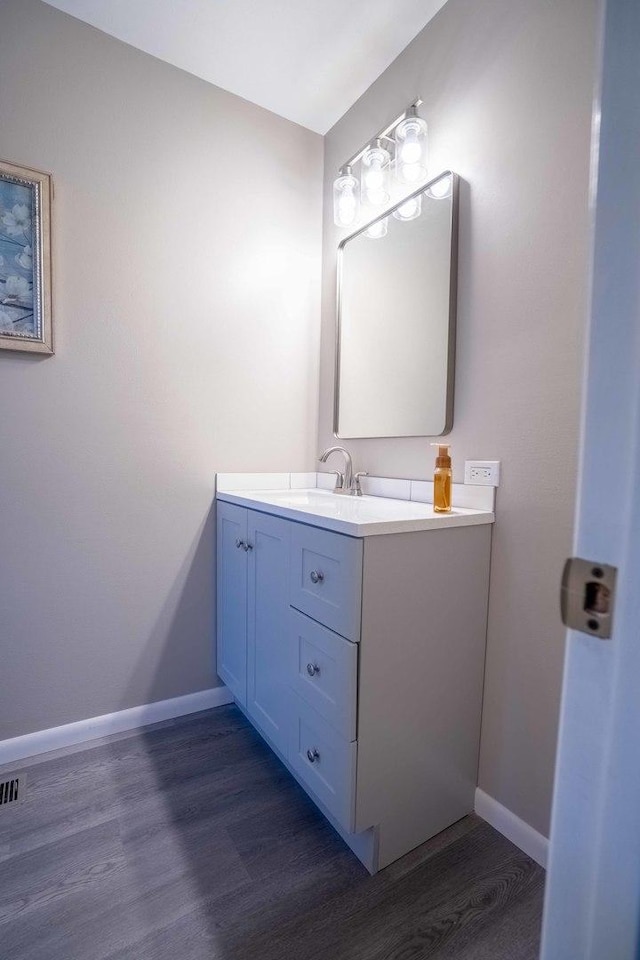 1745 N 40th Ave, Stone Park, IL 60165 - bathroom with vanity and wood finished floors