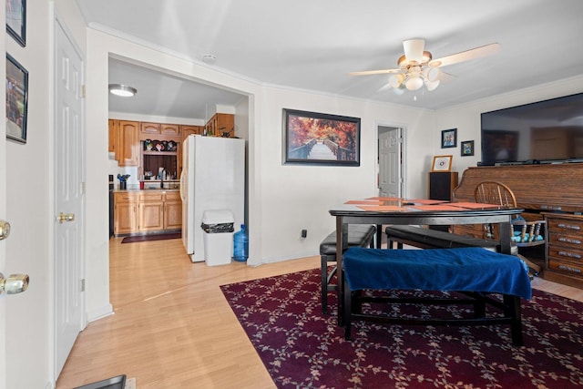 1508 N River Rd, Mchenry, IL 60051 - dining room featuring light wood-type flooring, ceiling fan, and ornamental molding
