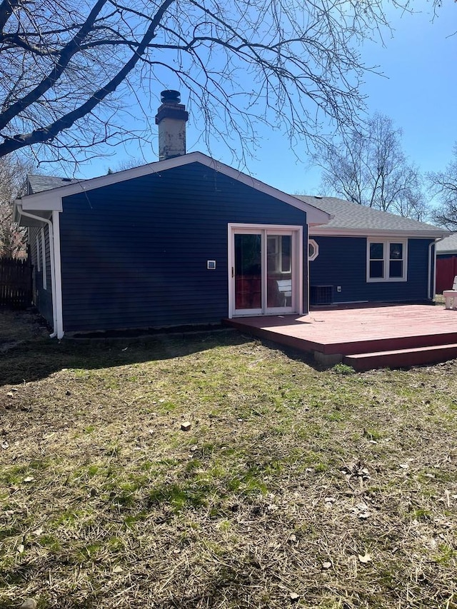 165 Arrowhead Ln, Bolingbrook, IL 60440 - rear view of house with a deck, a chimney, and a lawn