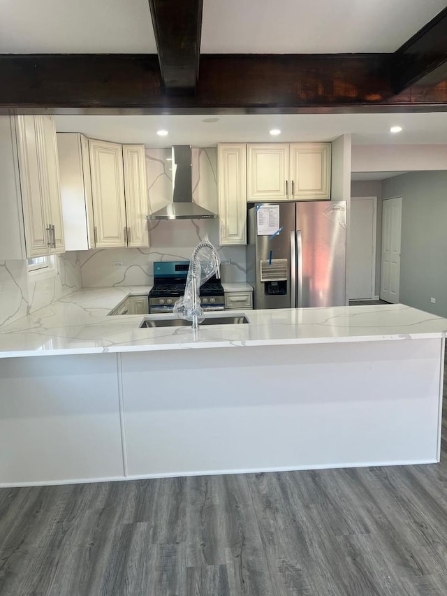 165 Arrowhead Ln, Bolingbrook, IL 60440 - kitchen featuring wall chimney range hood, stainless steel appliances, beamed ceiling, dark wood-style flooring, and a peninsula