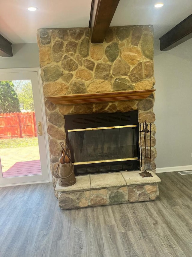 165 Arrowhead Ln, Bolingbrook, IL 60440 - detailed view of a fireplace, wood finished floors, and beam ceiling