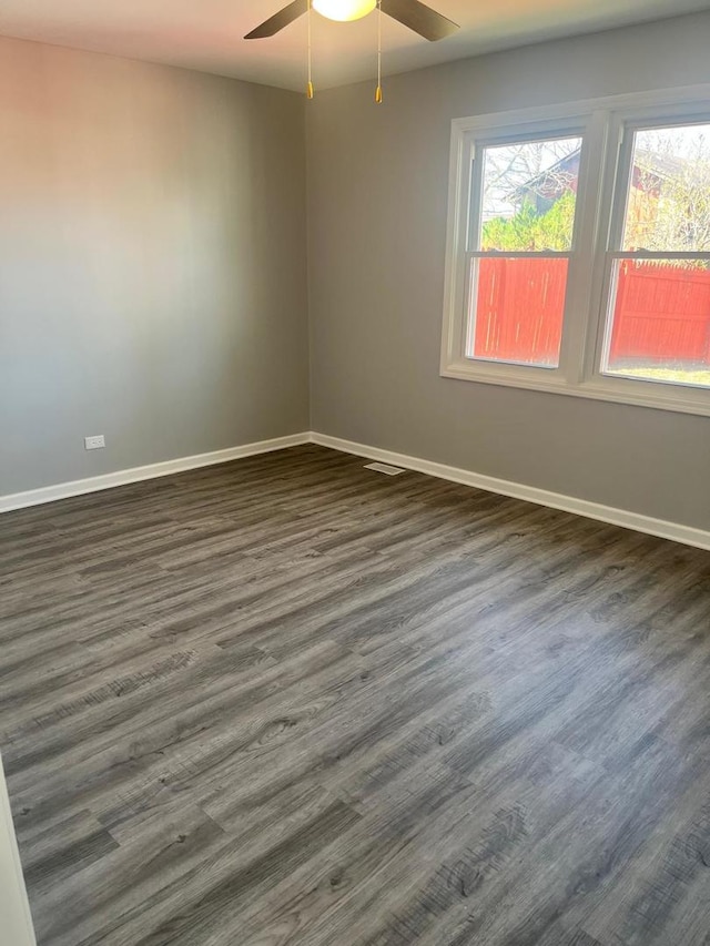 165 Arrowhead Ln, Bolingbrook, IL 60440 - spare room featuring ceiling fan and dark wood-style flooring