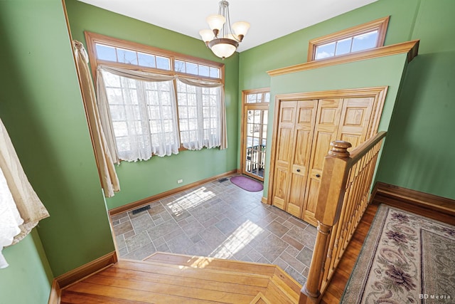 14723 Kildare Ave, Midlothian, IL 60445 - entrance foyer featuring a chandelier and stone finish floors