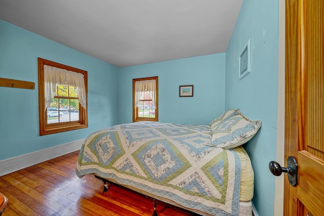14723 Kildare Ave, Midlothian, IL 60445 - bedroom with multiple windows and hardwood / wood-style floors