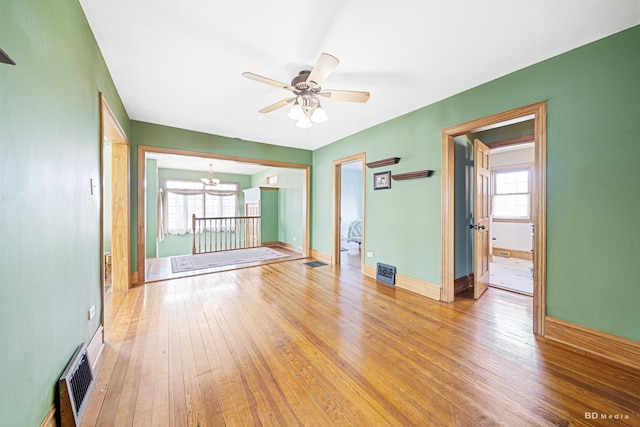 14723 Kildare Ave, Midlothian, IL 60445 - empty room with a chandelier, hardwood / wood-style flooring, and a ceiling fan