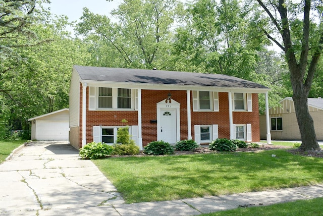 731 Union Dr, University Park, IL 60484 - raised ranch featuring brick siding, a front lawn, an outbuilding, a detached garage, and a shingled roof