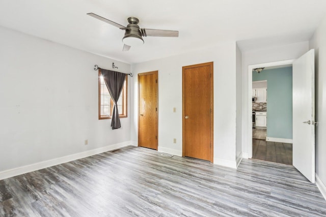 1888 Irene Rd, Sandwich, IL 60548 - unfurnished bedroom featuring wood finished floors and ceiling fan