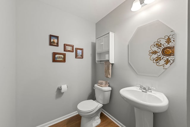 6308 Main St, Woodridge, IL 60517 - bathroom with wood finished floors and toilet