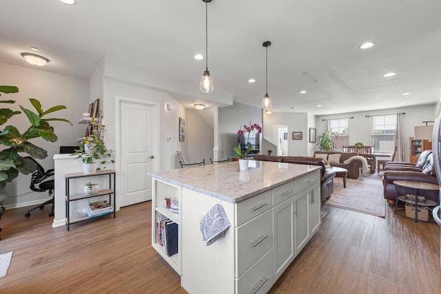 6308 Main St, Woodridge, IL 60517 - kitchen with wood finished floors, a kitchen island, open floor plan, hanging light fixtures, and recessed lighting