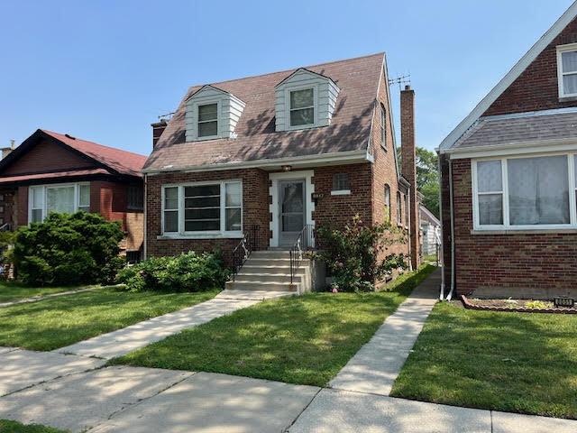 8047 S Mozart St, Chicago, IL 60652 - view of front of house featuring brick siding, a chimney, and a front lawn