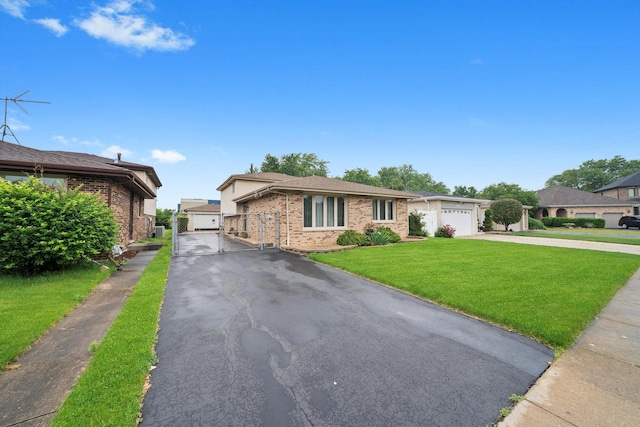 7542 Mason Ave, Burbank, IL 60459 - view of front facade featuring a gate, a front lawn, brick siding, and concrete driveway