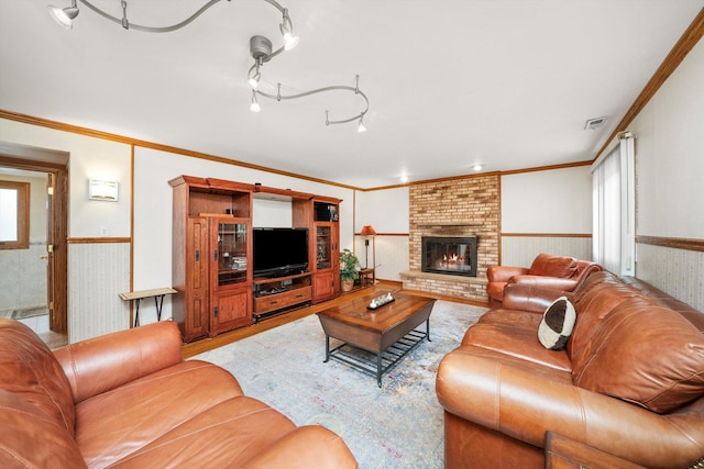 7542 Mason Ave, Burbank, IL 60459 - living area featuring a wainscoted wall, a brick fireplace, and ornamental molding