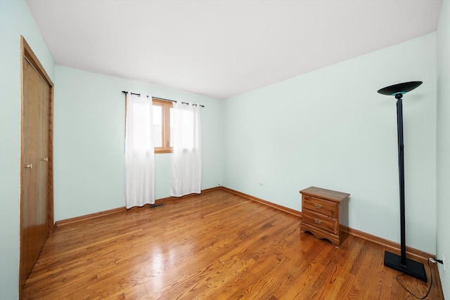 7542 Mason Ave, Burbank, IL 60459 - unfurnished bedroom featuring light wood finished floors and a closet