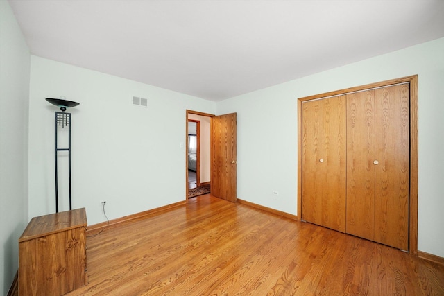 7542 Mason Ave, Burbank, IL 60459 - unfurnished bedroom with light wood-type flooring and a closet
