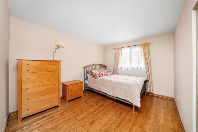 7542 Mason Ave, Burbank, IL 60459 - bedroom featuring light wood-type flooring and baseboards