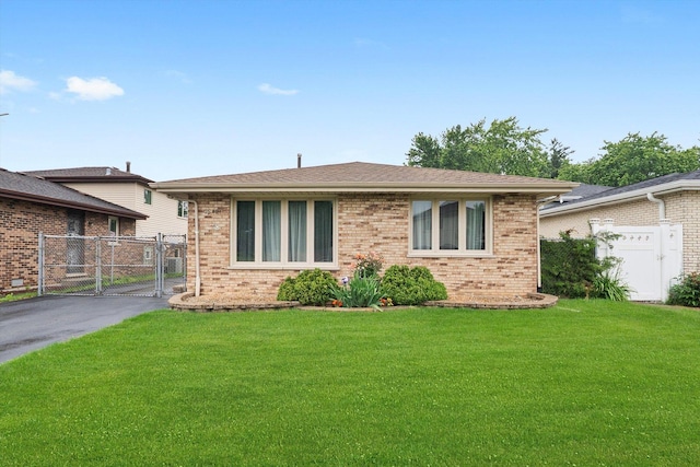 7542 Mason Ave, Burbank, IL 60459 - view of front of house with a gate and brick siding