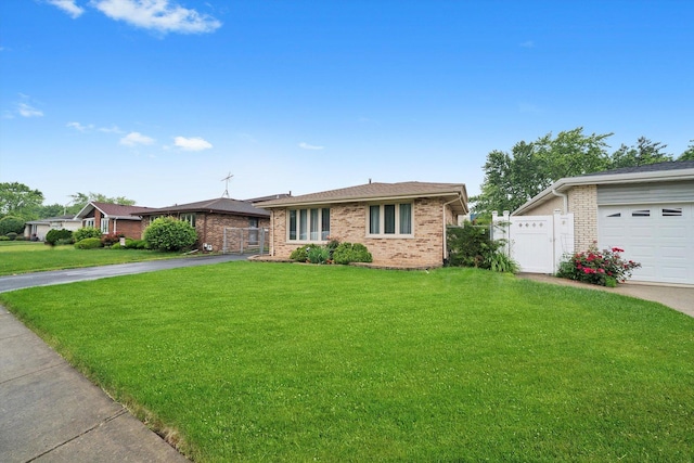 7542 Mason Ave, Burbank, IL 60459 - ranch-style home featuring asphalt driveway, brick siding, and a gate