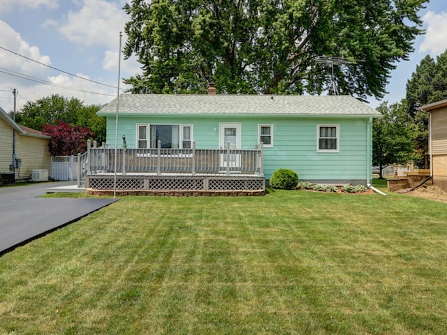 1806 New High St, Rock Falls, IL 61071 - view of front facade with a wooden deck, a front yard, and a chimney