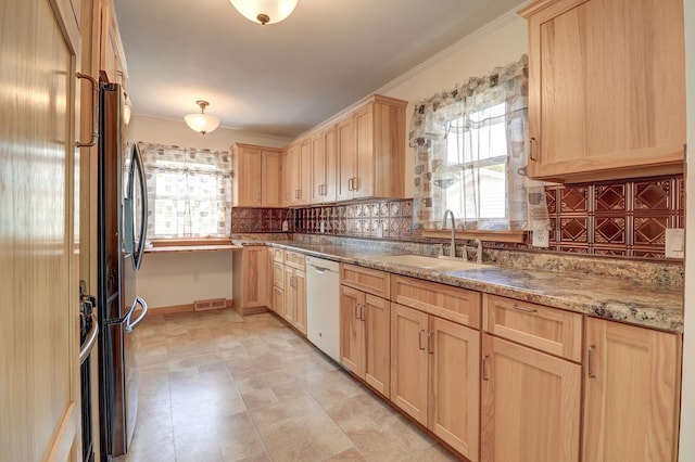 1806 New High St, Rock Falls, IL 61071 - kitchen featuring light brown cabinets, dishwasher, plenty of natural light, backsplash, and crown molding