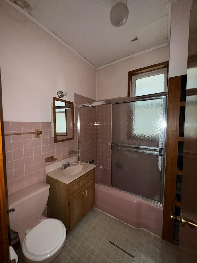 2130 W Concord Pl, Chicago, IL 60647 - bathroom featuring vanity, combined bath / shower with glass door, crown molding, tile walls, and tile patterned floors