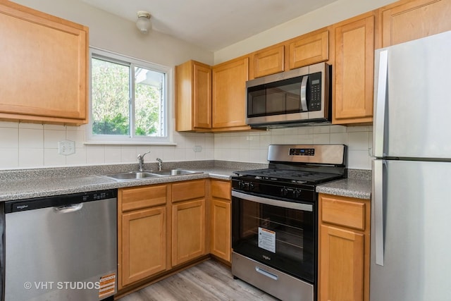 5S730 Malibu Ln, Naperville, IL 60540 - kitchen with appliances with stainless steel finishes, backsplash, and light wood-style flooring