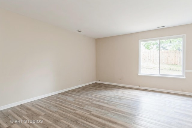 5S730 Malibu Ln, Naperville, IL 60540 - spare room featuring light wood finished floors and baseboards