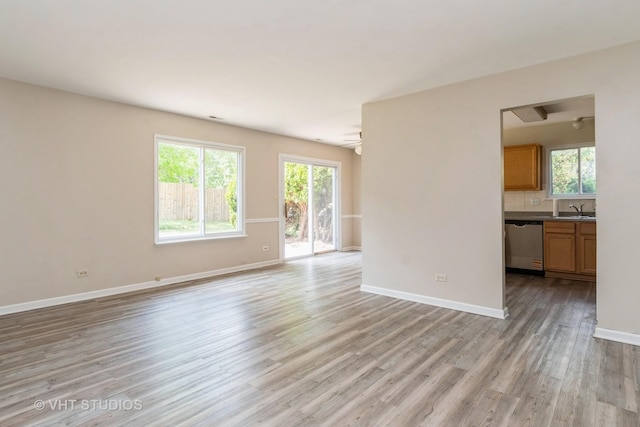 5S730 Malibu Ln, Naperville, IL 60540 - unfurnished living room with light wood-style floors and ceiling fan