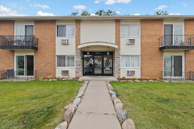 8916 Kenneth Dr Unit 1E, Des Plaines, IL 60016 - view of building exterior featuring a wall mounted AC