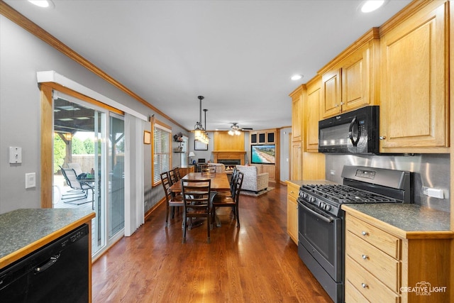 189 Cross St, Sugar Grove, IL 60554 - kitchen with black appliances, a ceiling fan, dark countertops, a lit fireplace, and ornamental molding