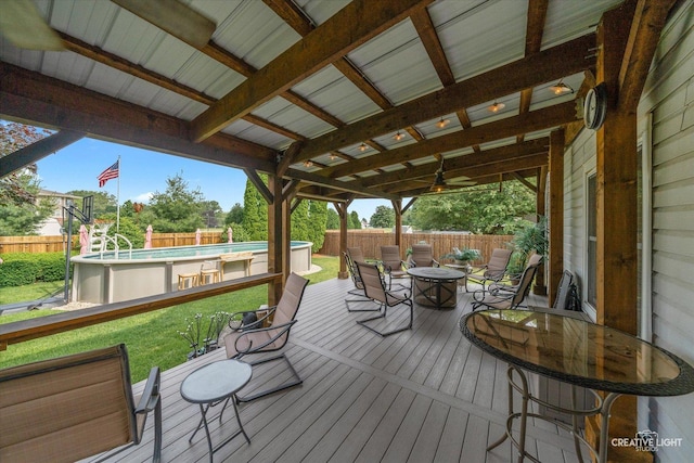 189 Cross St, Sugar Grove, IL 60554 - wooden deck with outdoor dining area, ceiling fan, and a fenced backyard